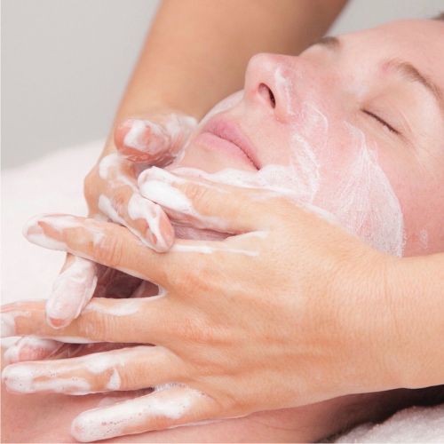 Client getting facial service at Lacey salon, Kally